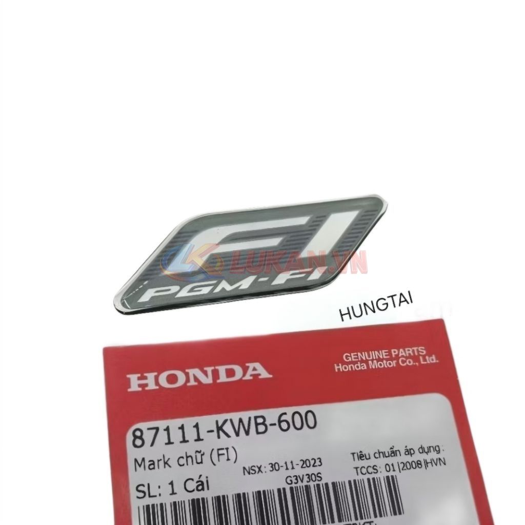 Tem đen logo FI nhựa đầu đèn xe WAVE, FUTURE... zin Honda 87111-KWB-600